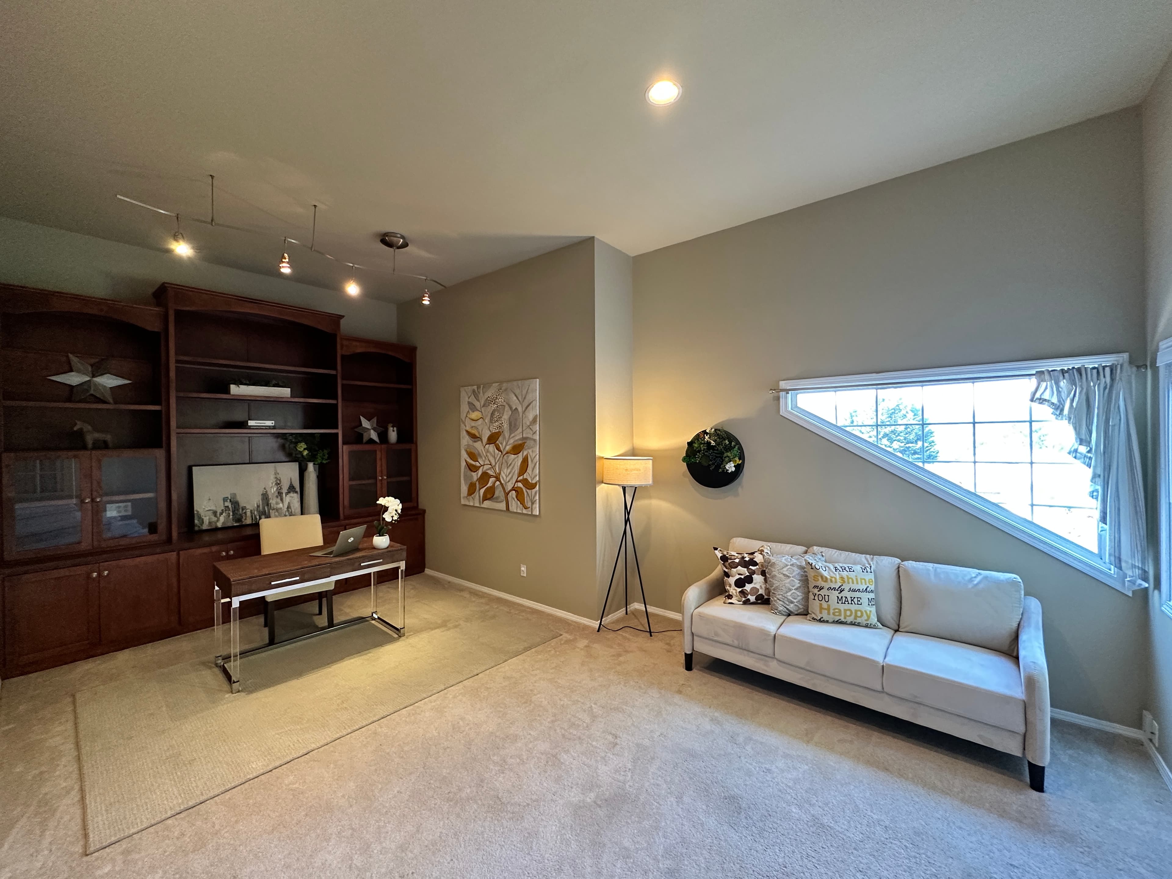 Home Office — Dark Built-In Shelving, Writing Desk & Cream Sofa