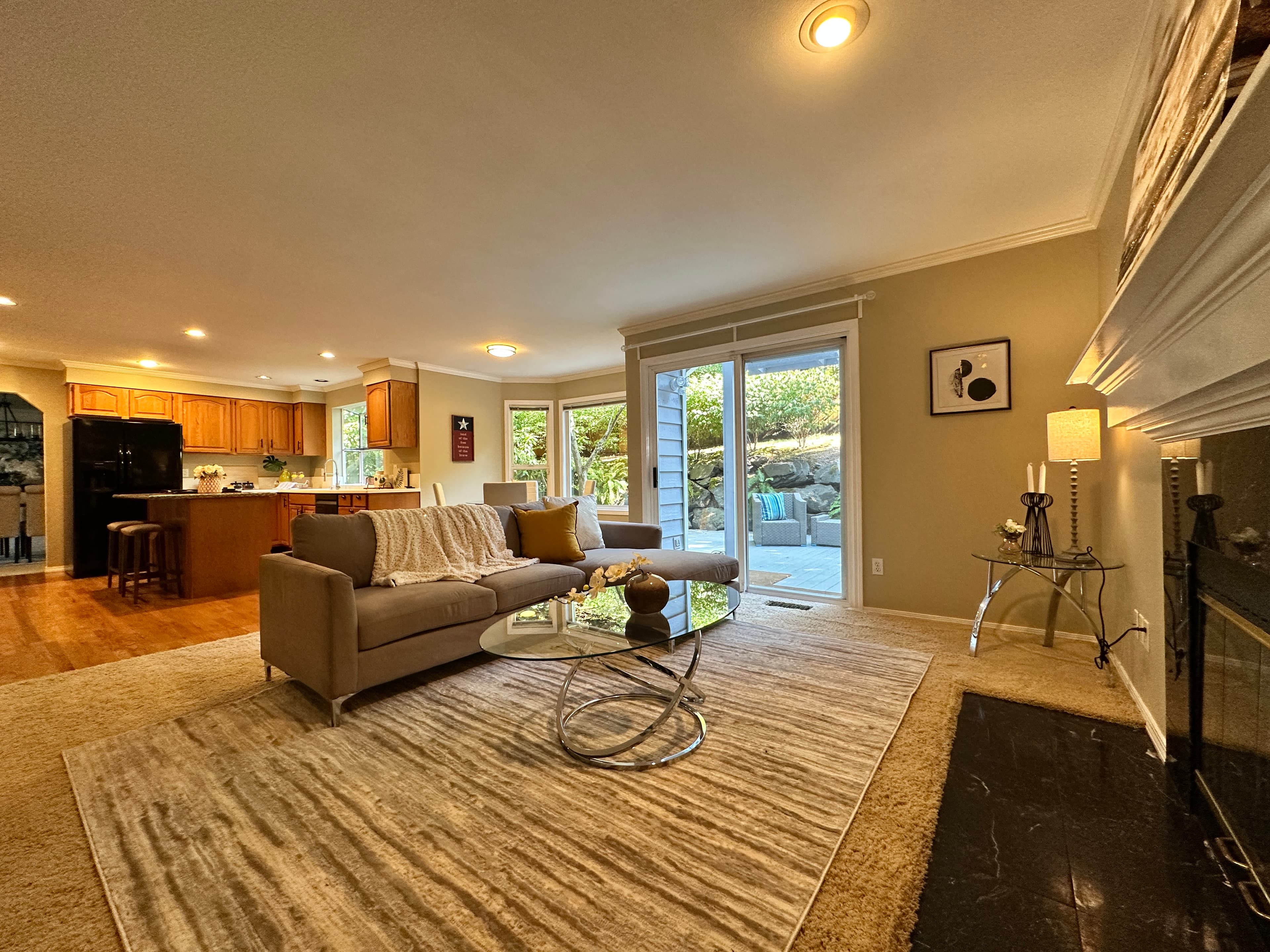 Living Room — Open Plan with Sectional, Fireplace & Sliding Door to Patio