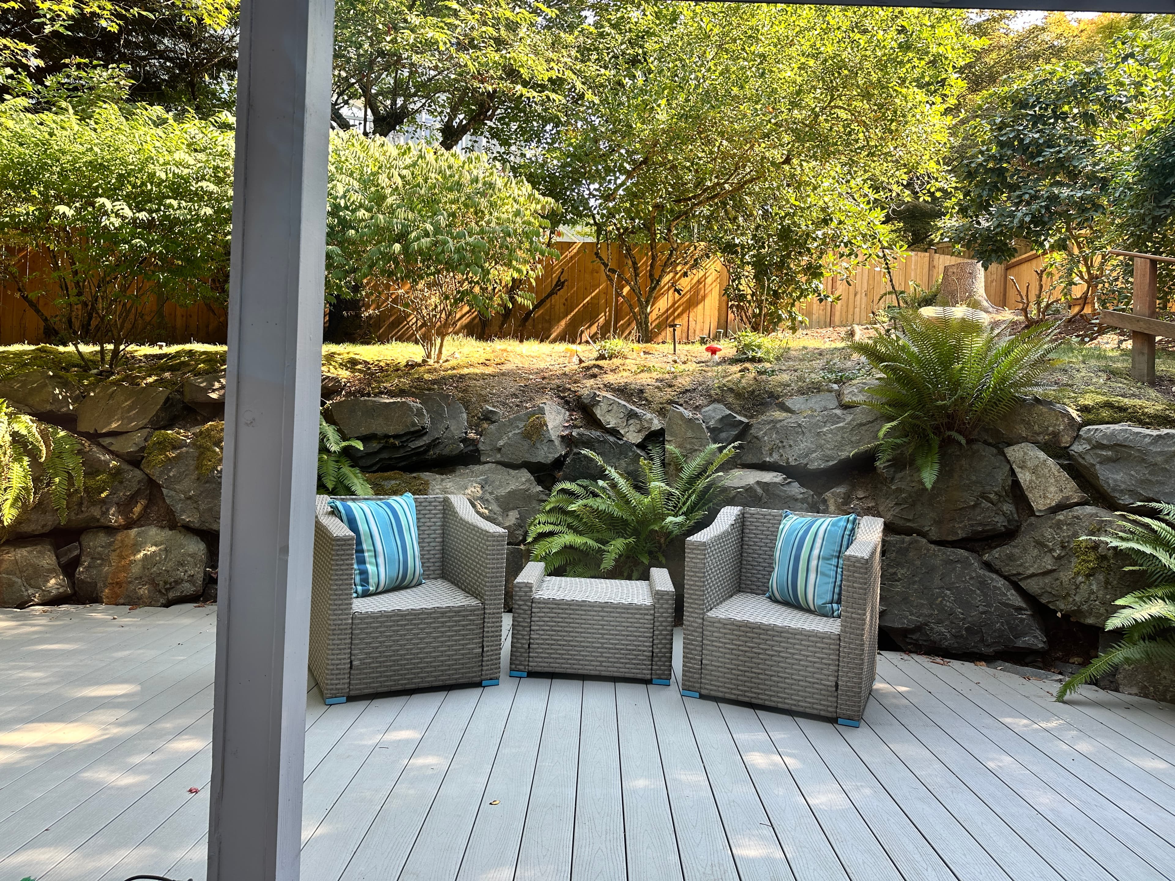 Outdoor — Deck with Gray Lounge Chairs & Rock Retaining Wall with Ferns