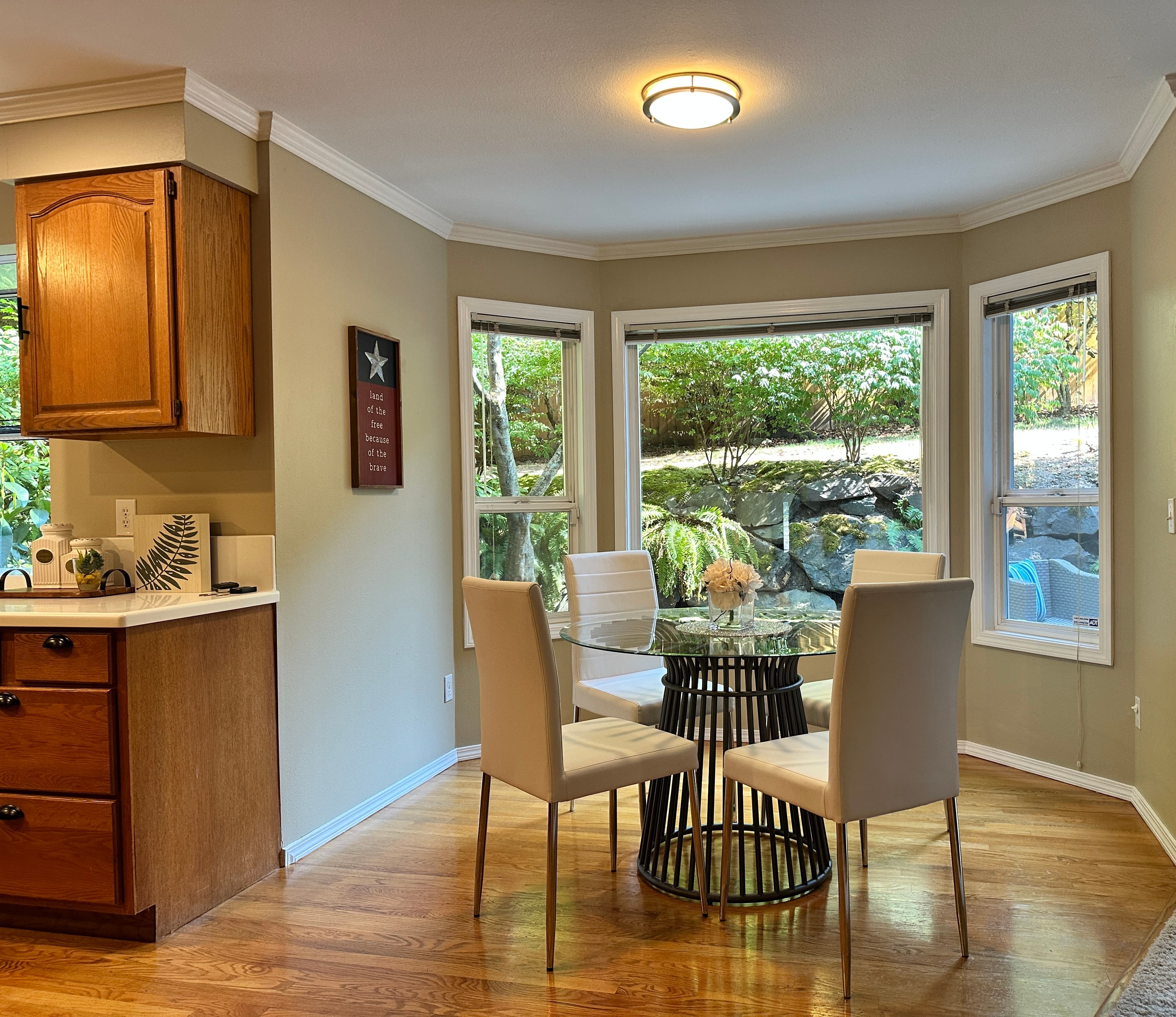 Breakfast Nook — Round Glass Table, Chairs & Bay Windows