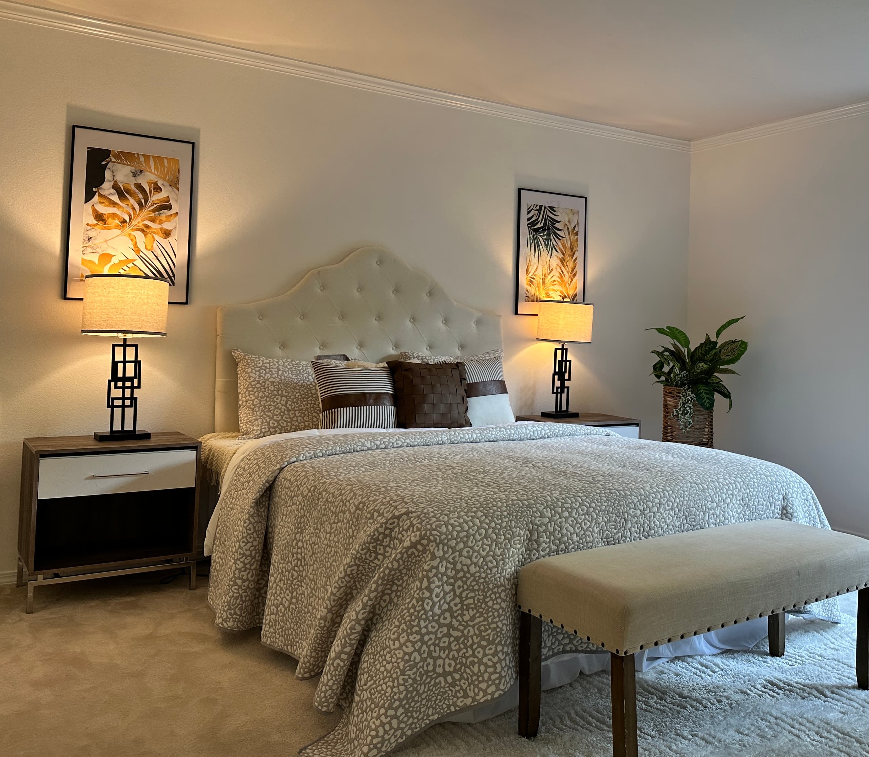 Primary Bedroom — White Tufted Headboard, Animal Print Bedding & Upholstered Bench