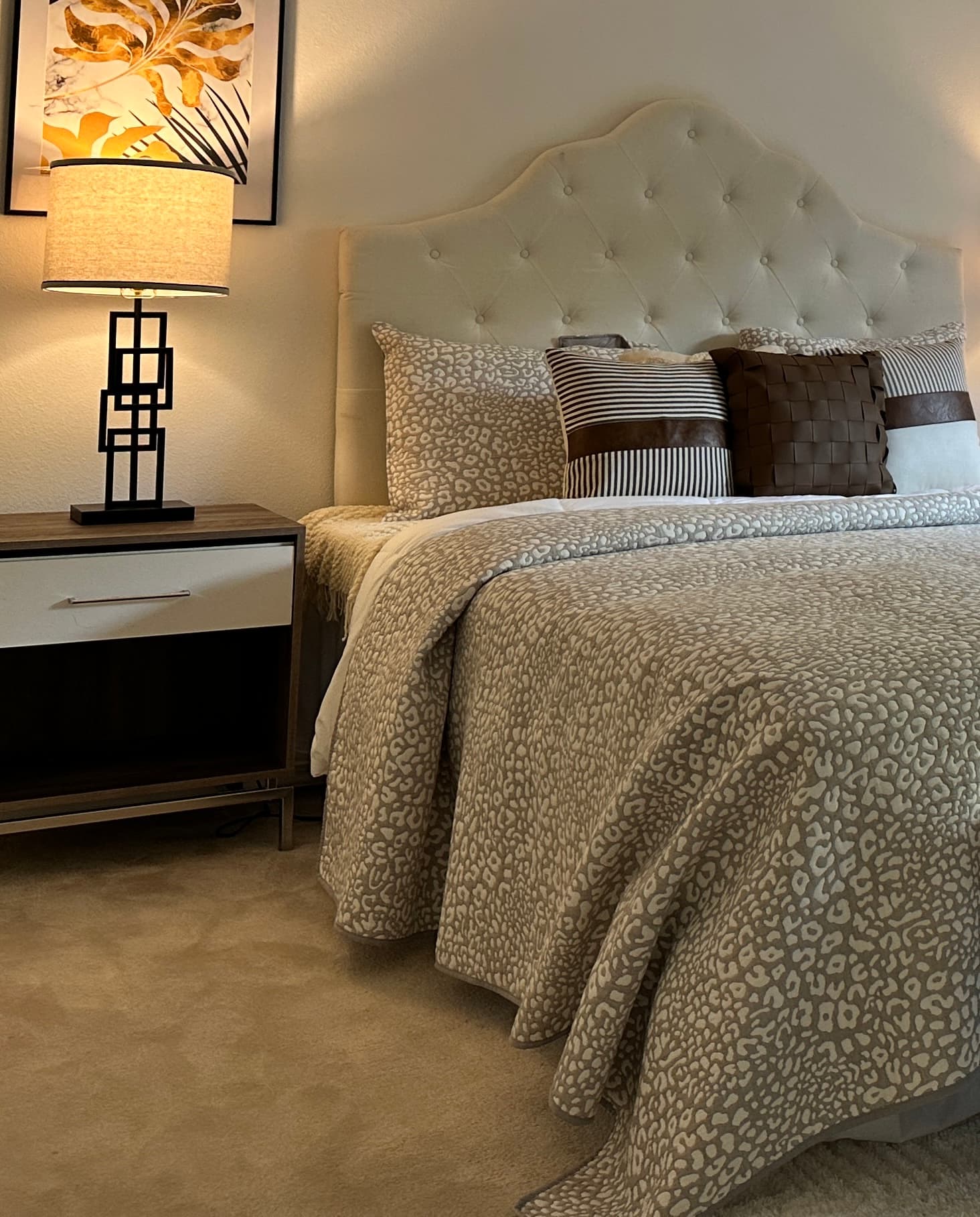 Primary Bedroom — Tufted Headboard Close-Up with Art Deco Lamp & Botanical Art