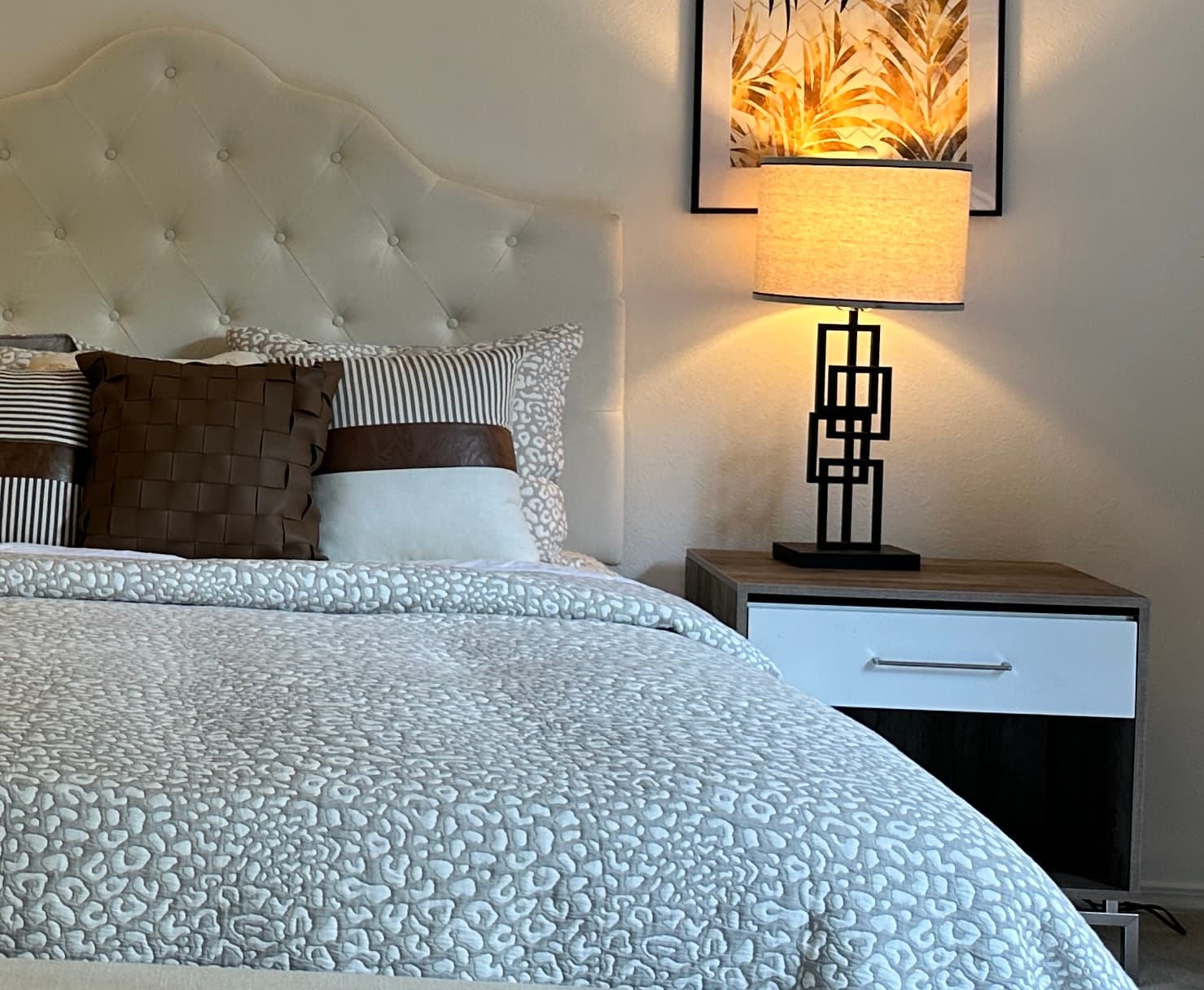 Primary Bedroom — Nightstand Detail with Art Deco Lamp & Tropical Leaf Art