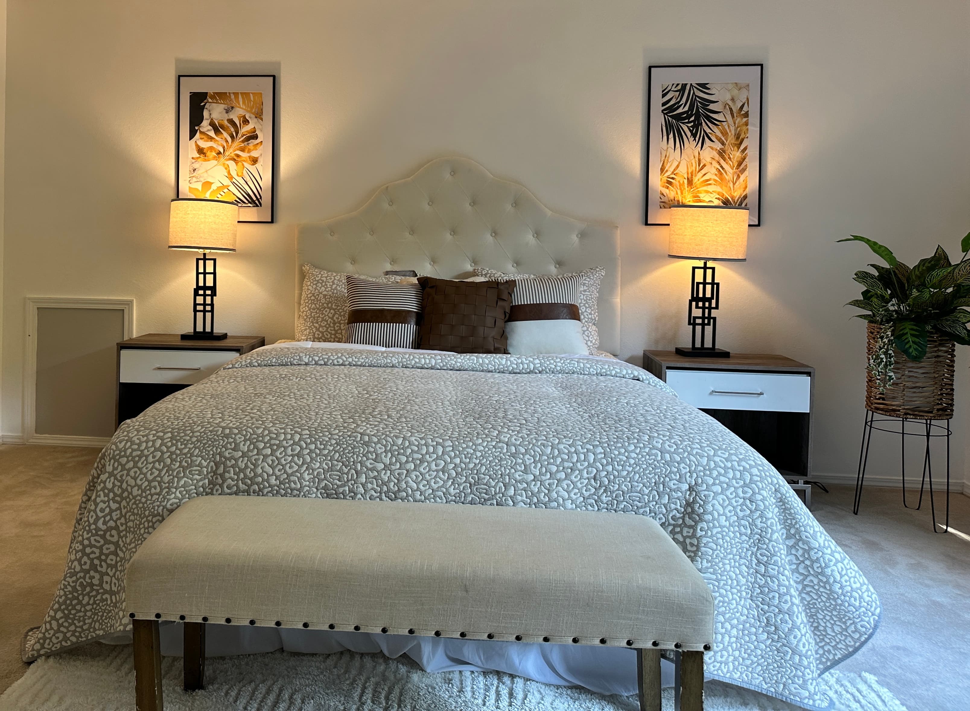 Primary Bedroom — Full View with Dual Botanical Art & Matching Nightstands