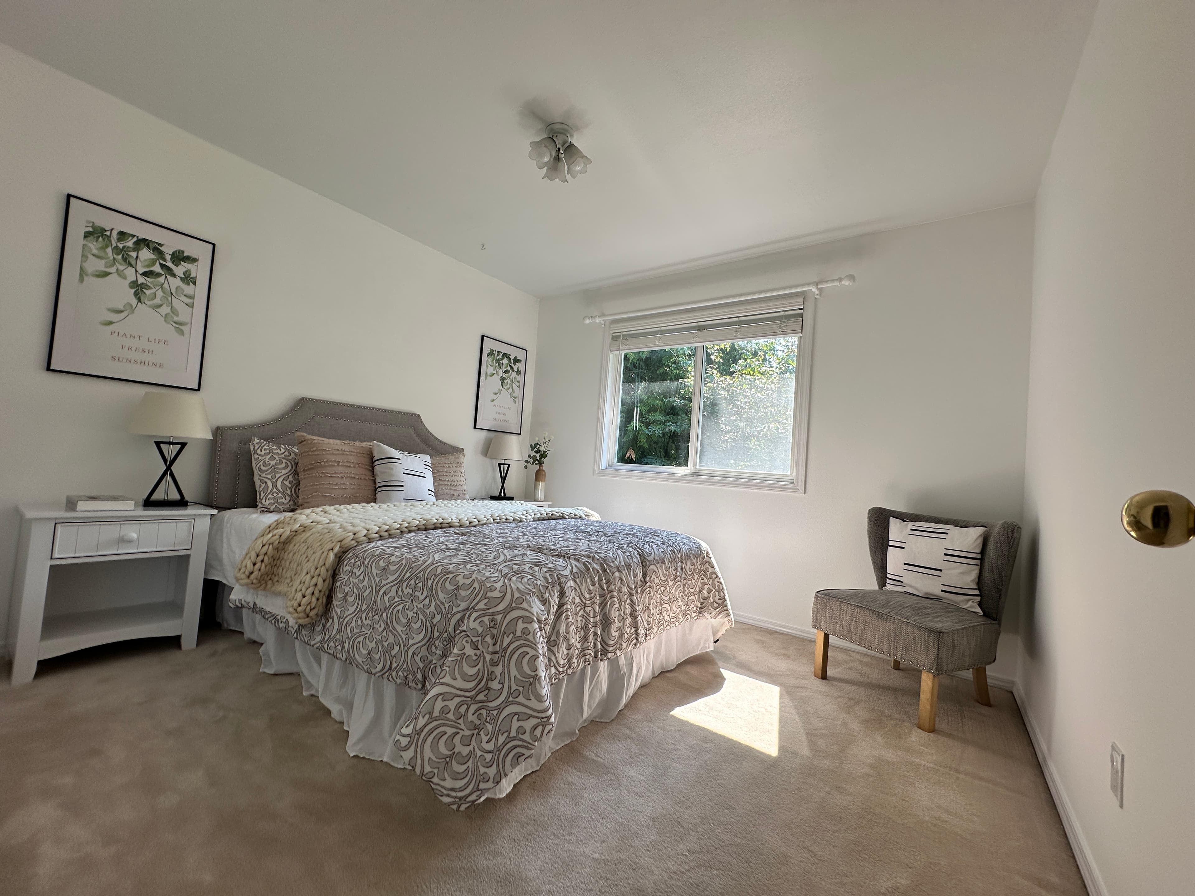 Guest Bedroom — White Headboard, Leopard Print Bedding & Accent Chair