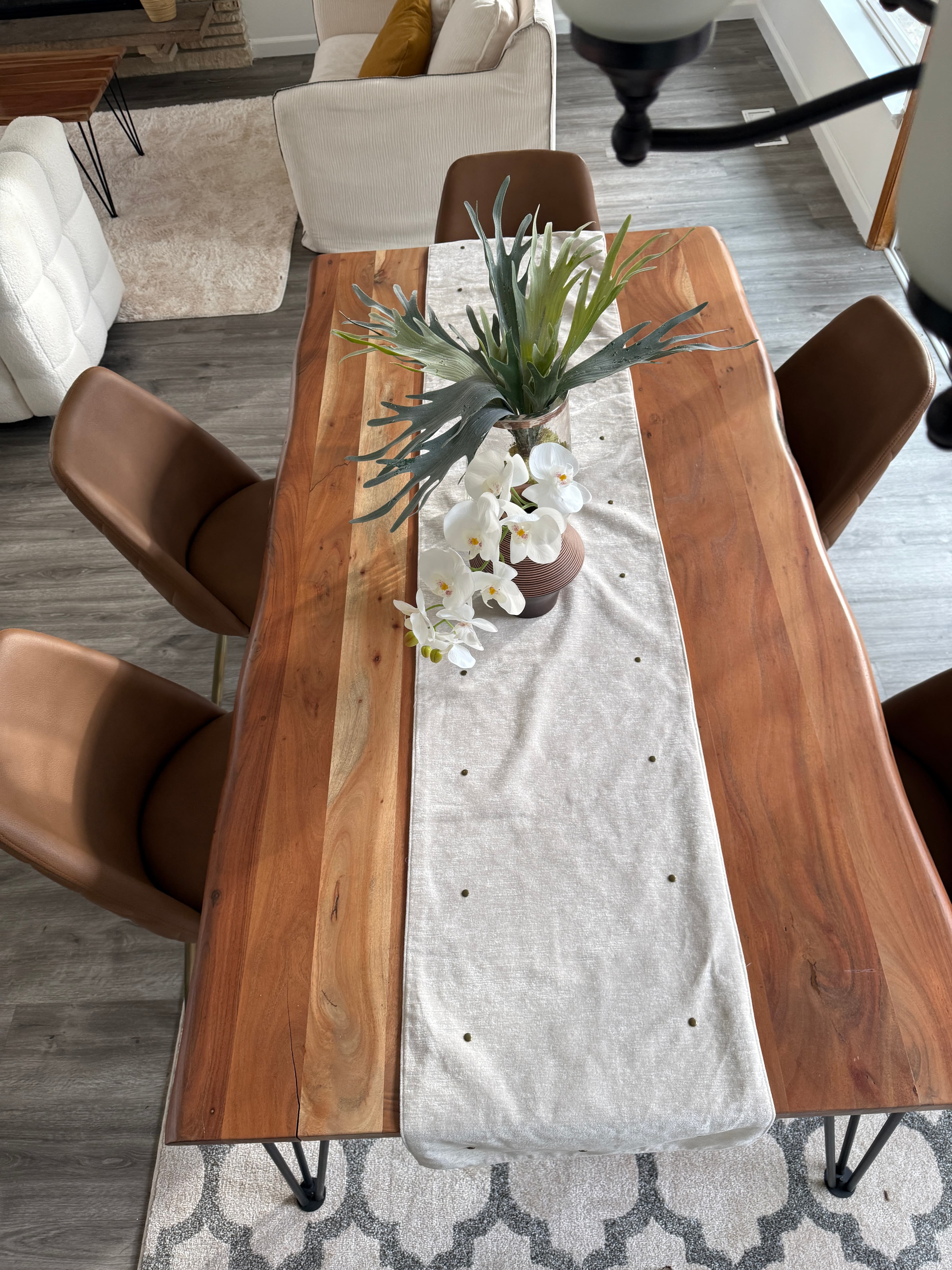 Dining Room — Live-Edge Table Close-Up with White Orchid (Overhead)