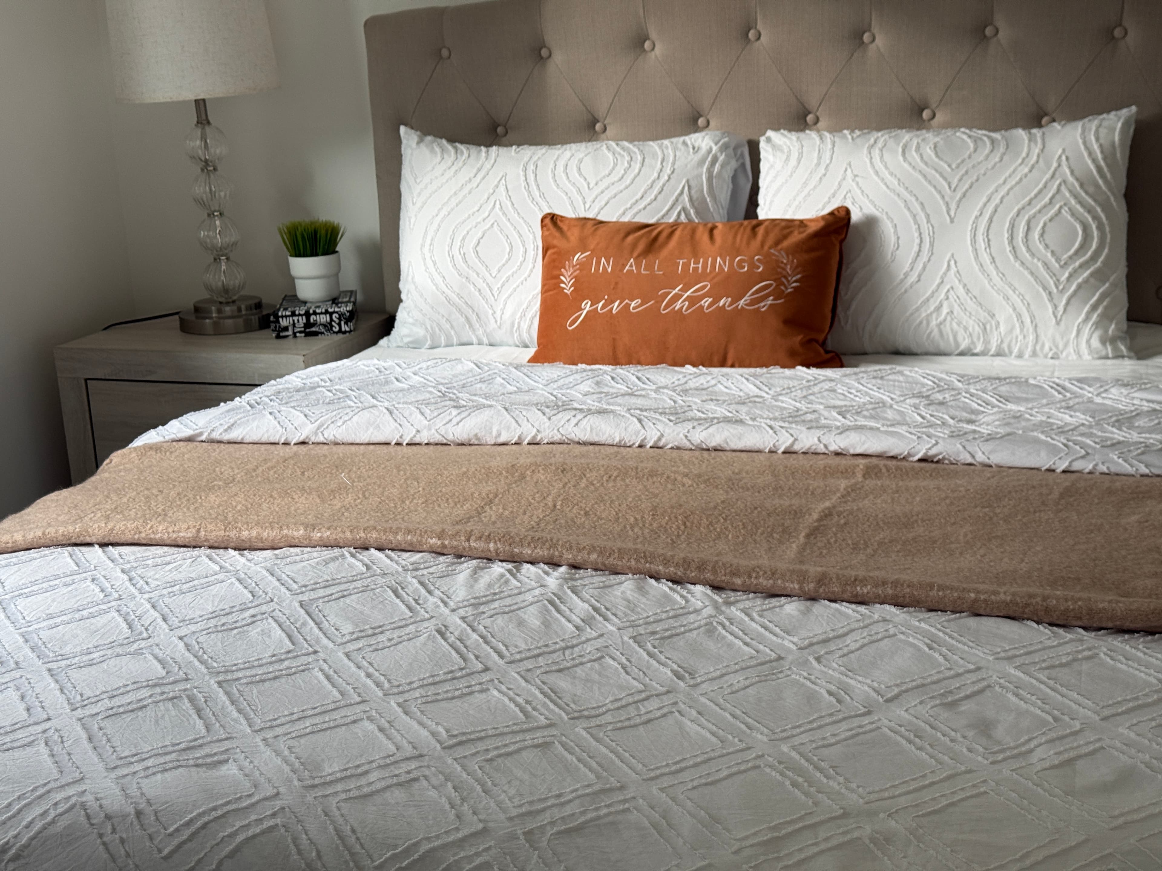 Guest Bedroom — Gray Tufted Headboard, White Diamond Quilt & Terracotta Pillow