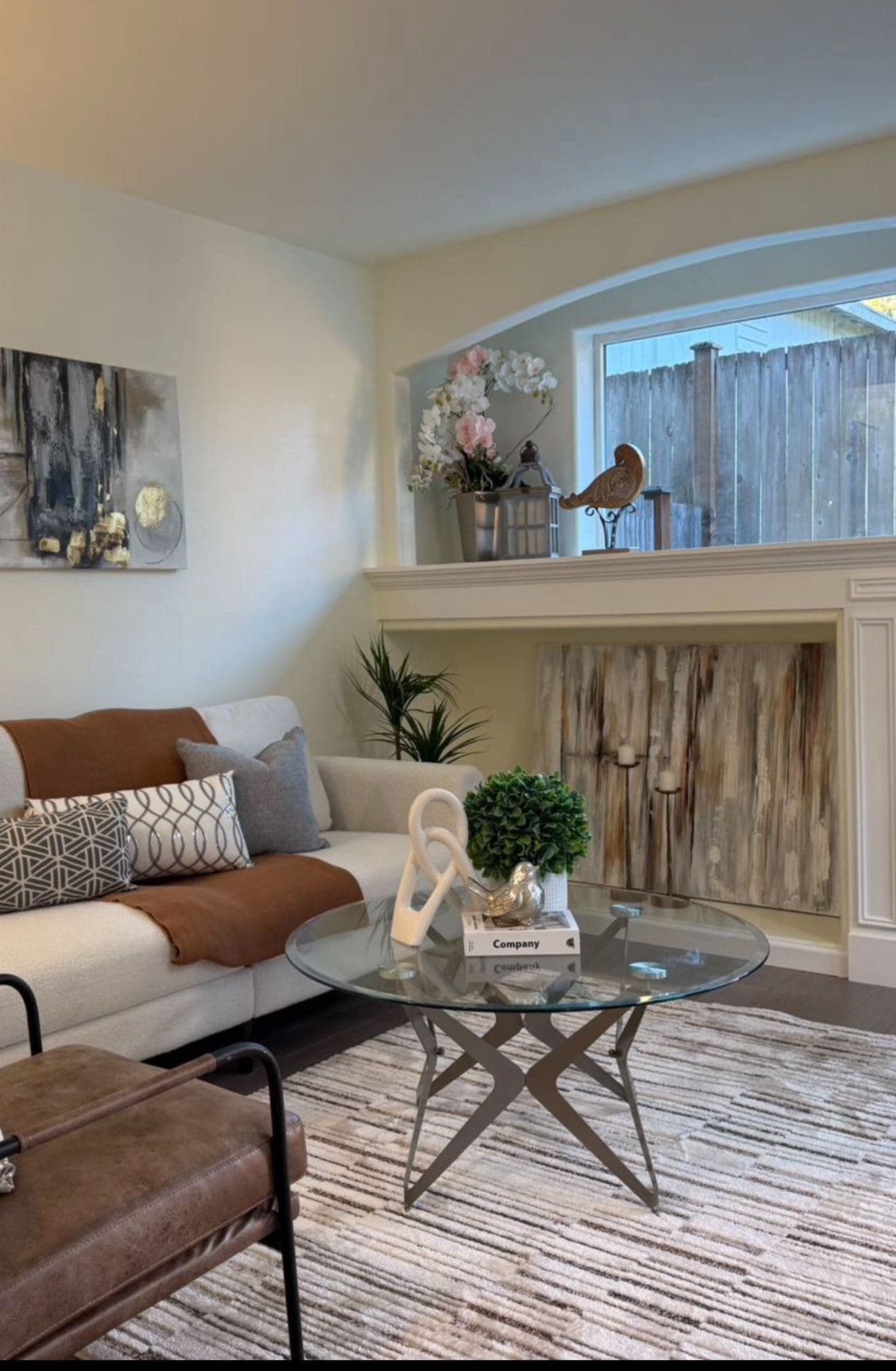 Living Room — Glass Coffee Table & Fireplace Detail