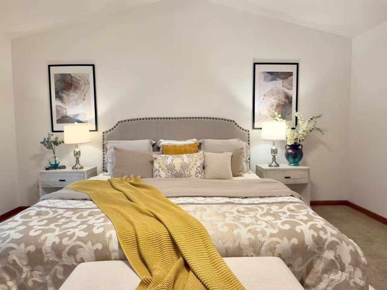 Primary Bedroom — Gray Nailhead Headboard & Mustard Throw