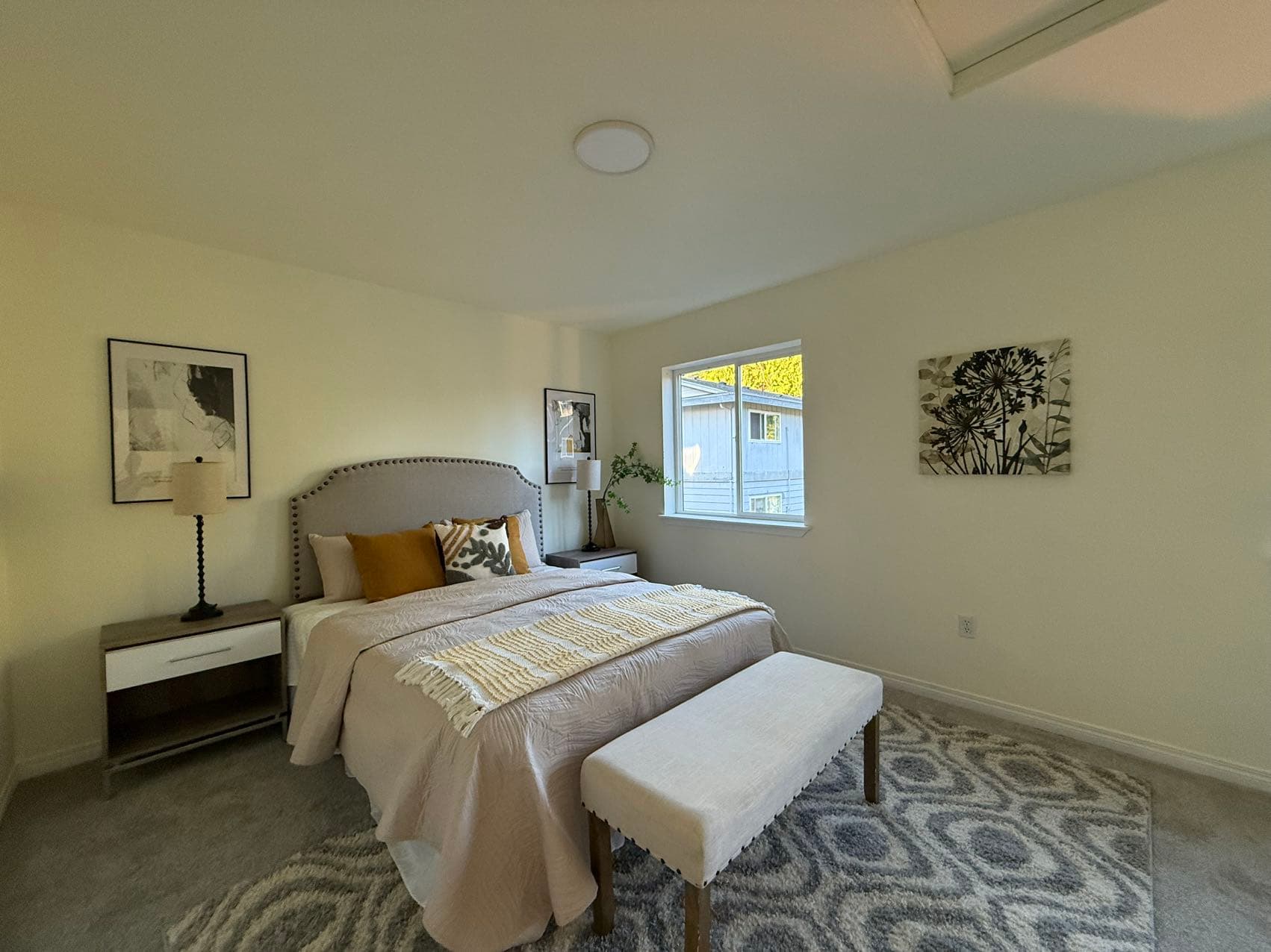 Primary Bedroom — Gray Upholstered Headboard & Gold Accents